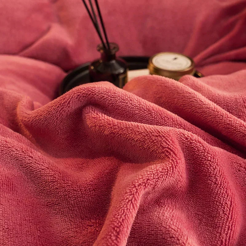 Corner view of thick velvet fleece comforter, showcasing its thermal insulation and soft, luxury bedding for warmth.