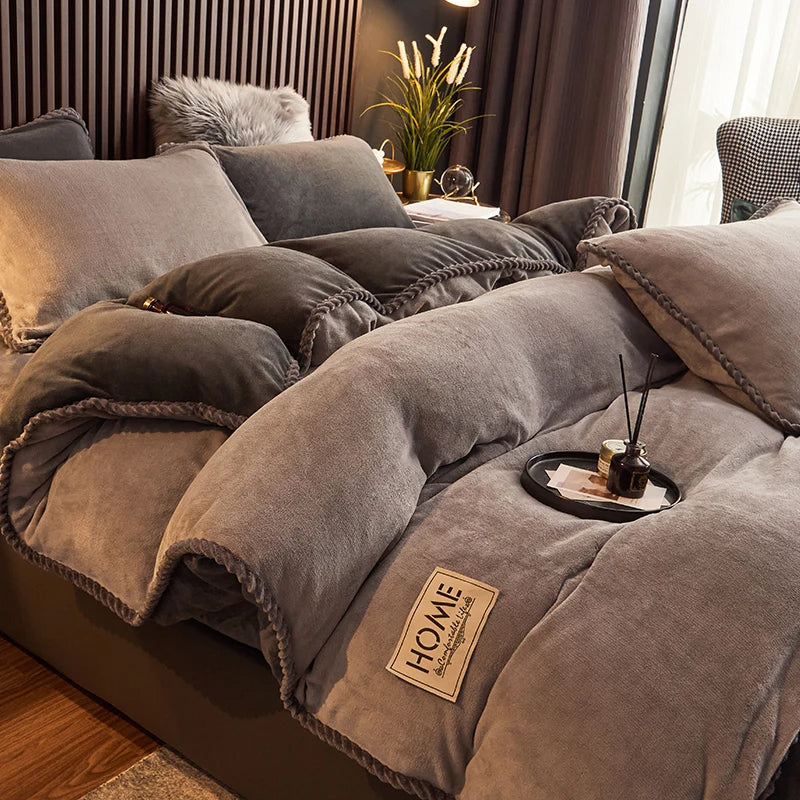 Elegant velvet fleece comforter set spread on a bed, offering luxury bedding and ultimate warmth for cozy nights.