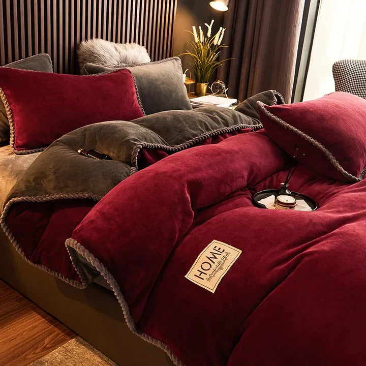 Person snuggling into a soft velvet fleece comforter set, experiencing cozy winter warmth and luxury comfort.