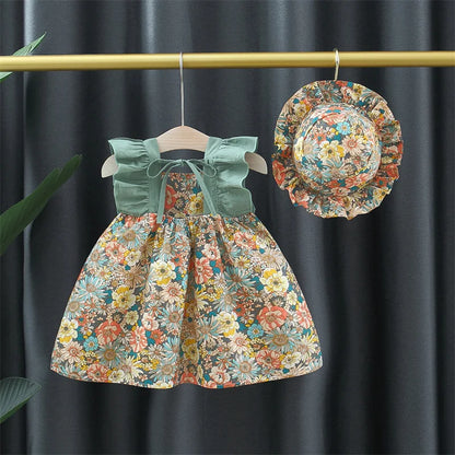 "Vestito floreale da bambina in cotone con cappello giallo, ideale per l'estate, perfetto per look eleganti e freschi."