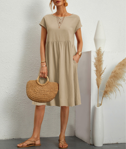 "Vestito midi estivo donna elegante poliestere, taglio largo, orlo ampio, colori vibranti, perfetto per occasioni estive."