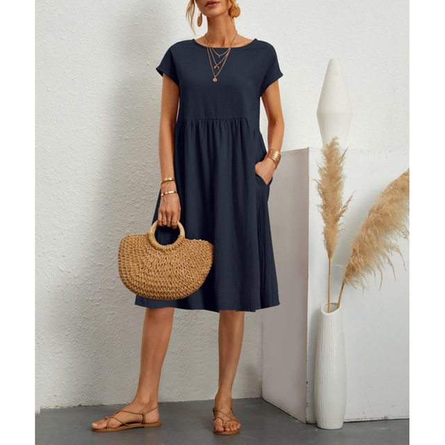 "Vestito midi estivo donna elegante poliestere, taglio largo, orlo ampio, colori vibranti, perfetto per occasioni estive."