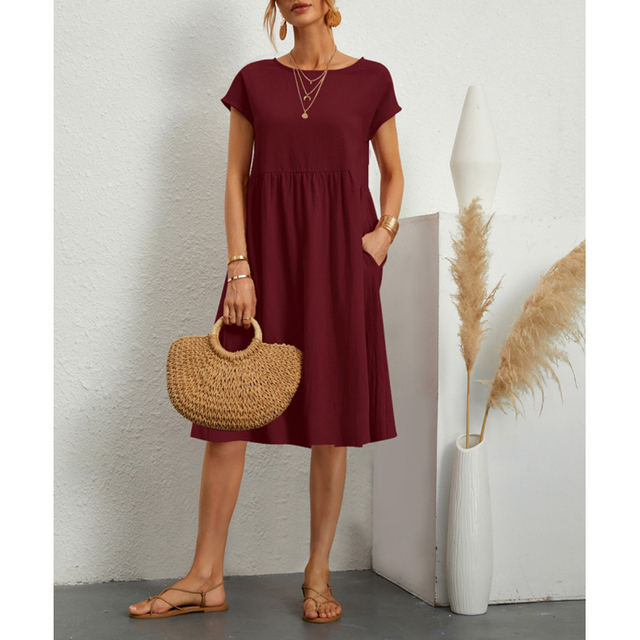 "Vestito midi estivo donna elegante poliestere, taglio largo, orlo ampio, colori vibranti, perfetto per occasioni estive."