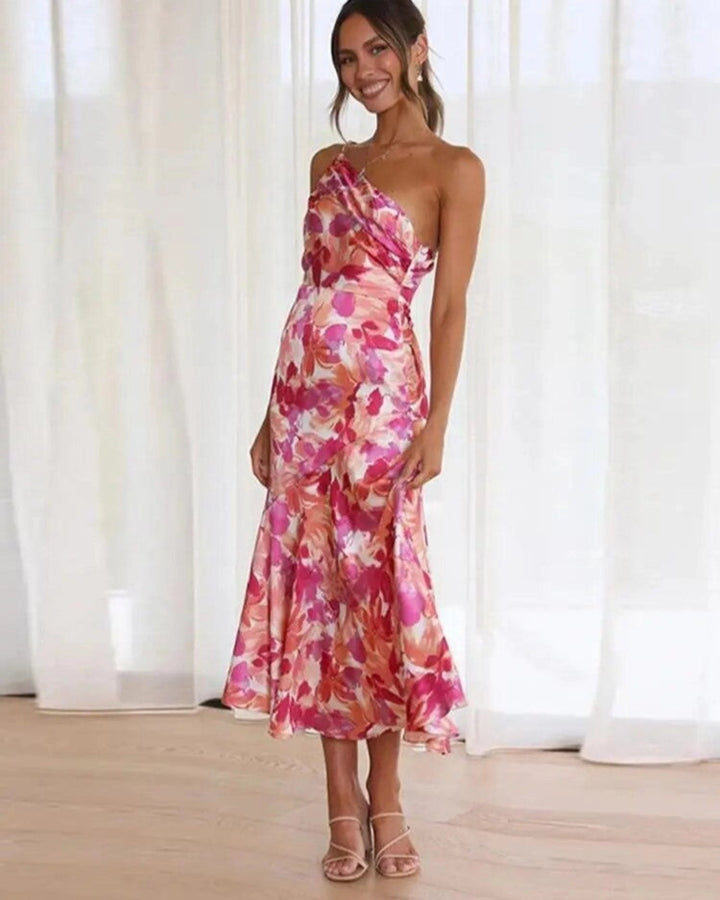 Vibrant floral asymmetric midi dress for women, sleeveless with a flowing hem, perfect for summer elegance.