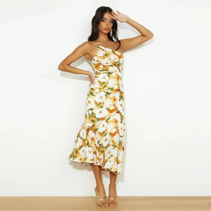 Chic women's floral midi dress, sleeveless, asymmetric design with a beautiful flowing hem, summer ready.