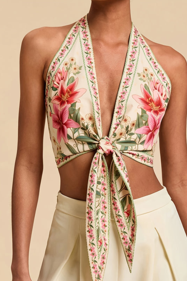 Trendy women's vibrant floral halter top, essential for summer fashion and a chic vacation look.