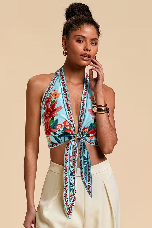 Detailed vibrant floral print on women's halter top, a chic choice for summer fashion.