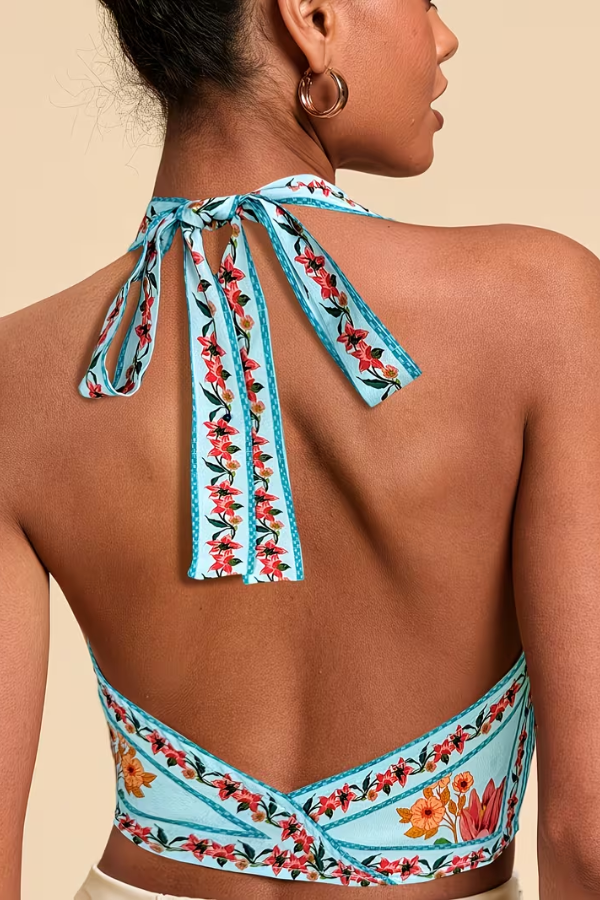 Stylish women's vibrant floral halter top, sleeveless and perfect for summer fashion & beach wear.