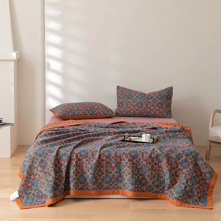Eco-friendly orange & blue six-layer cotton duvet. Breathable, soft bedding quilt for a refreshing bedroom.