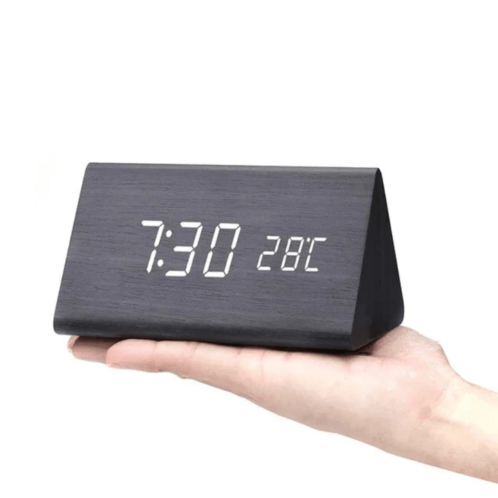 Contemporary voice activated LED wooden clock, combining smart features with natural aesthetics.