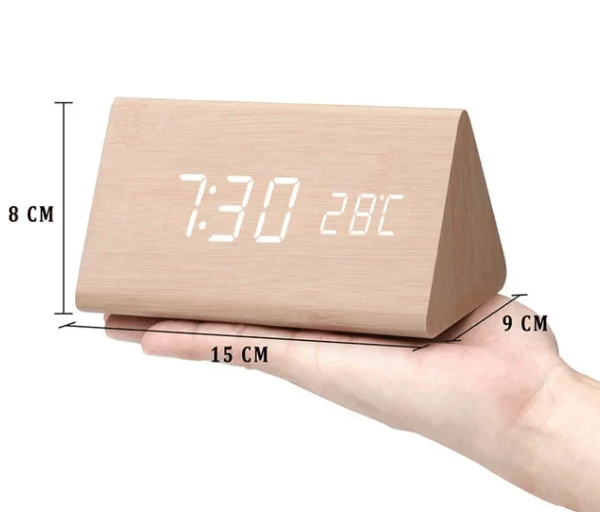 Close-up of a voice activated LED wooden digital clock showing time, enhancing modern decor.