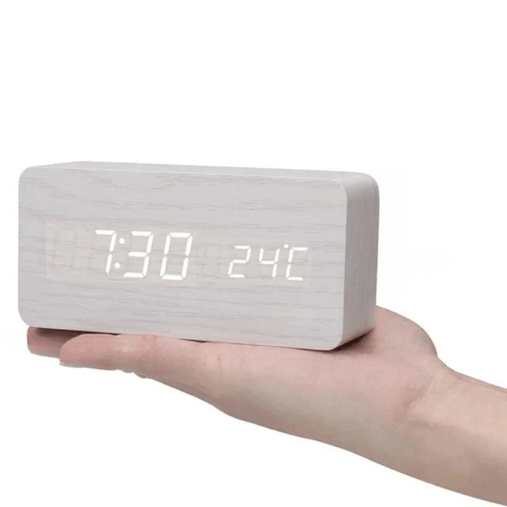 Voice activated wooden LED clock with clear digital display, a modern smart desk accessory.