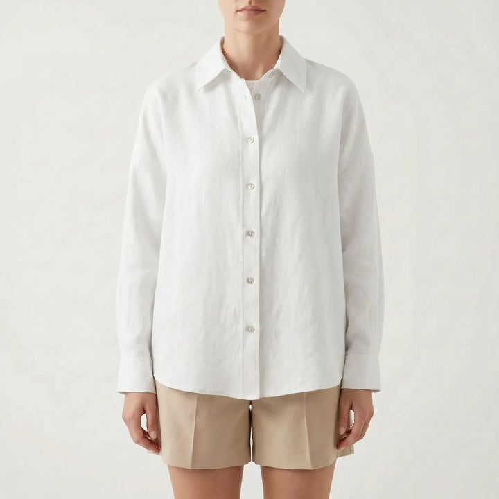 Woman models a stylish oversized button-down shirt, a relaxed fit casual top perfect for warm weather or layering.
