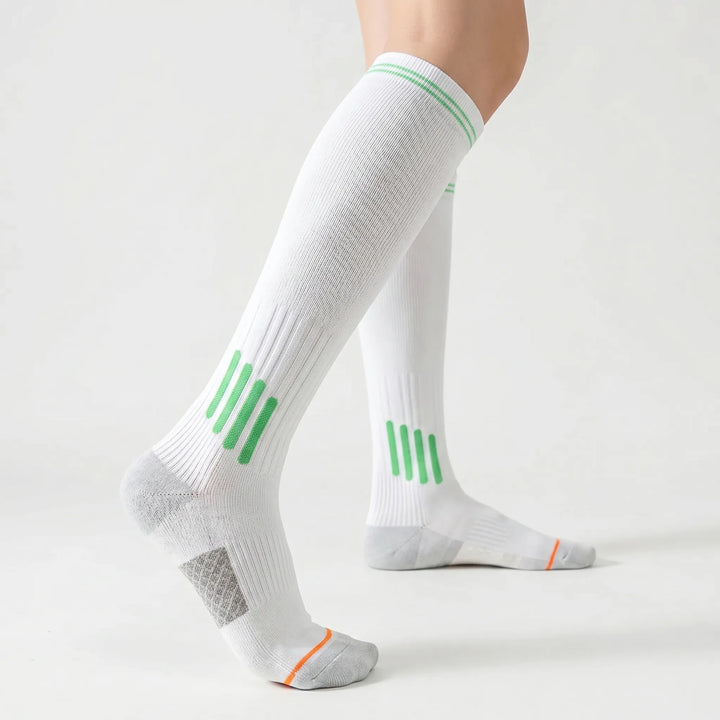 Women's activewear white knee-high sport socks, perfect for workouts.