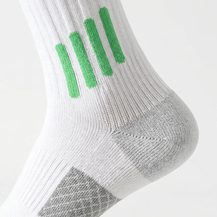Pair of white knee-high athletic socks designed for women's training gear.