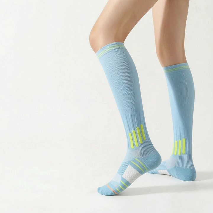 Sporty white knee-high running socks, ideal activewear for women.