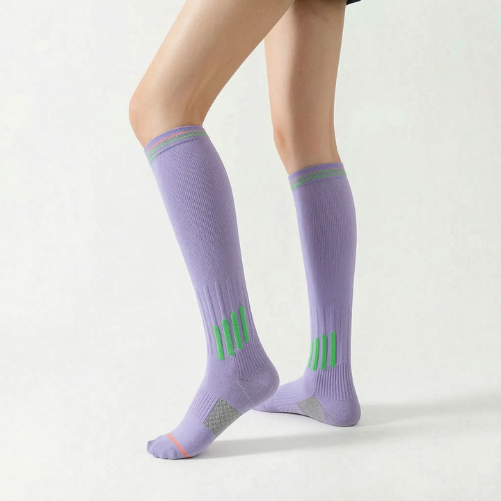 Durable women's white athletic knee-high socks for intense training.