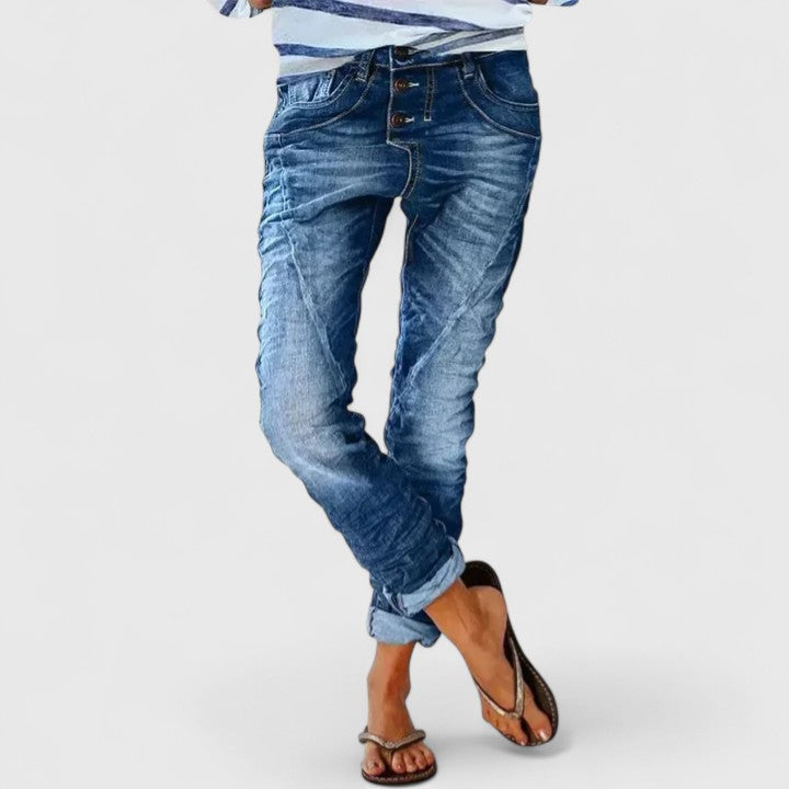 Stylish women's acid wash skinny jeans with bold contrast stitch, offering a modern western denim look.