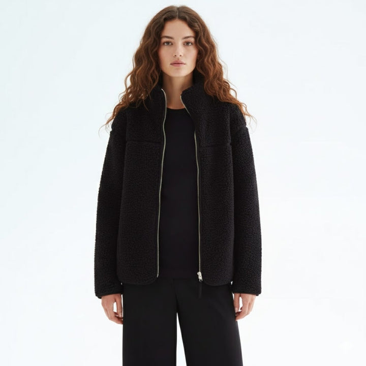 Comfortable fall/winter adaptive jacket for women, designed for maternity, baby carrier, & versatile use.