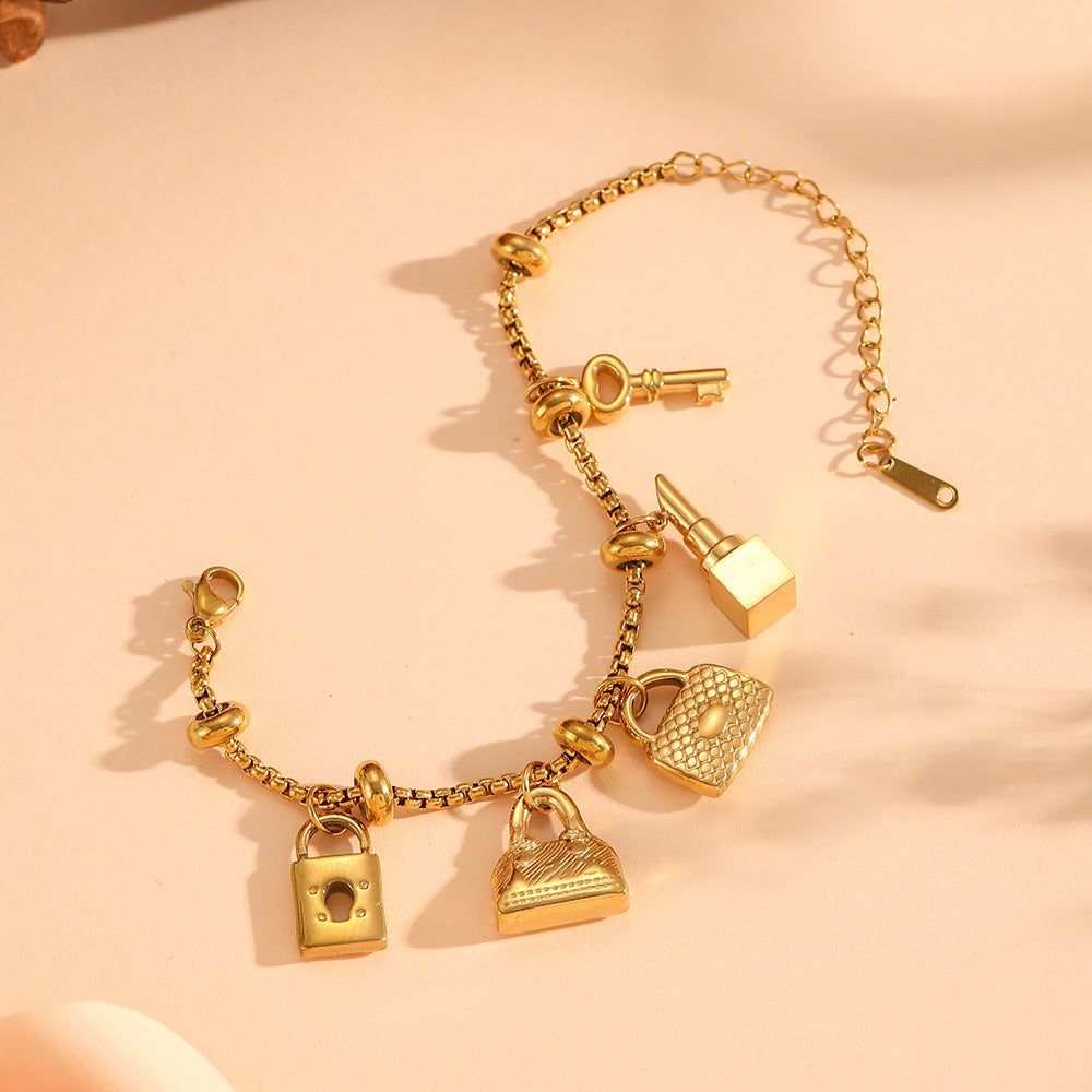 Sparkling rhinestone charm bracelet, women's adjustable gold-tone jewelry with unique, elegant charms.