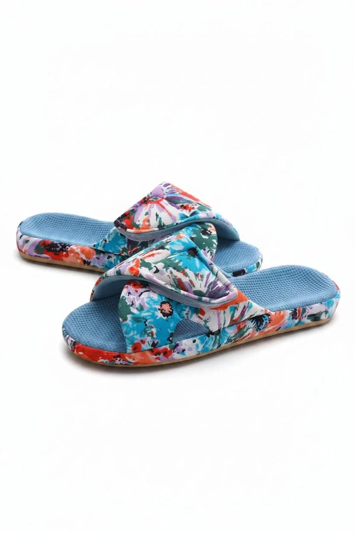 Pair of soft women's adjustable open-toe slippers, designed for ultimate comfort and indoor relaxation.