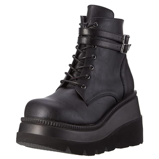 Model wearing Women's Adora platform ankle boots, highlighting edgy alternative fashion and comfort.