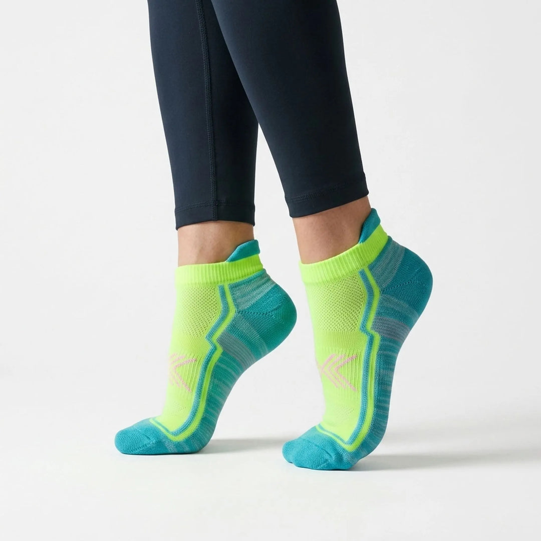 Green women's ankle-length athletic socks, ideal for running & activewear.