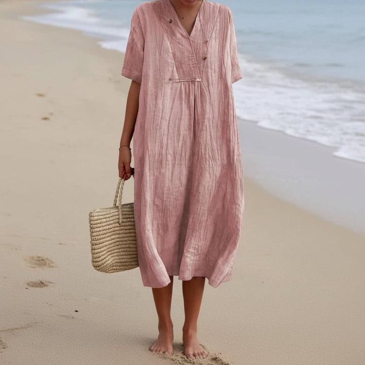 Effortless women's V-neck A-line summer midi dress. Soft, comfortable fabric for versatile warm-weather style.