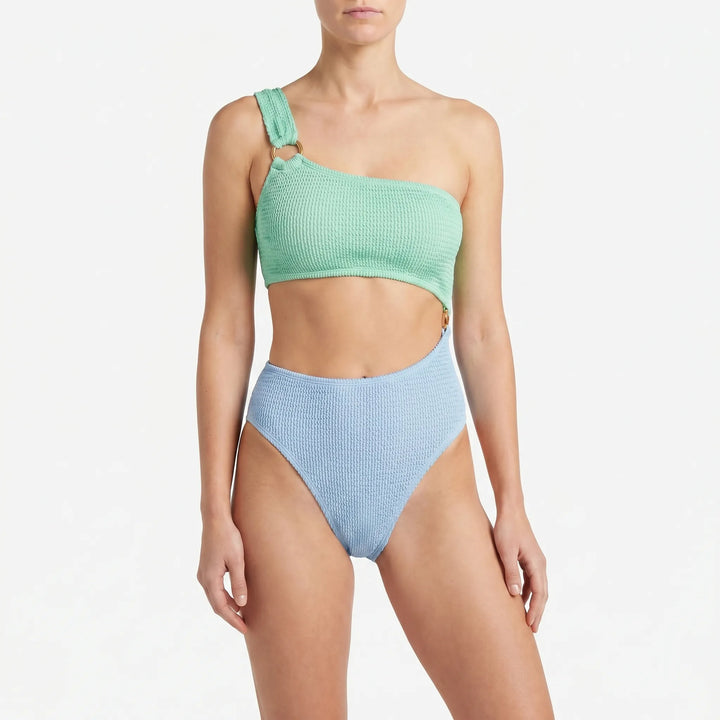 Trendy women's monokini swimsuit featuring an asymmetric silhouette and chic cut-outs with gold detail.