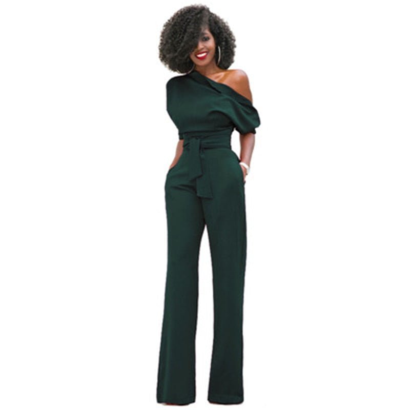 Detail shot of an elegant women's asymmetrical one-shoulder jumpsuit, highlighting its unique neckline and drape.