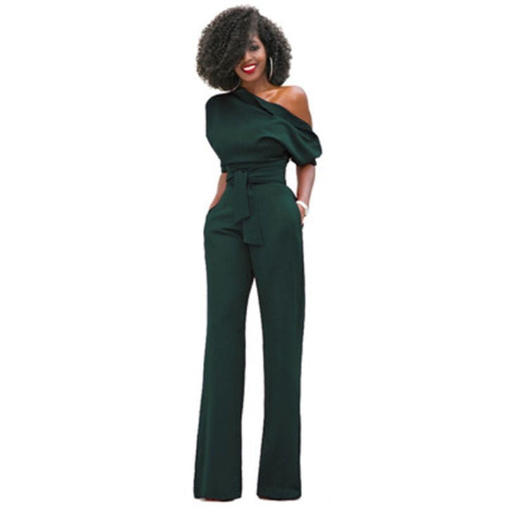 Detail shot of an elegant women's asymmetrical one-shoulder jumpsuit, highlighting its unique neckline and drape.