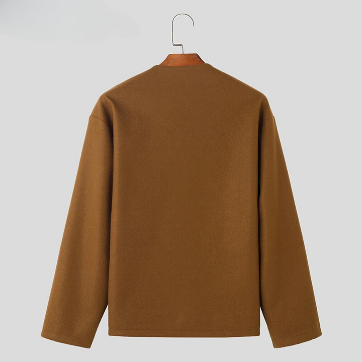 Woman wearing a versatile Avelon button-up jacket, perfect for a casual outing. Long sleeve, round neckline outerwear.