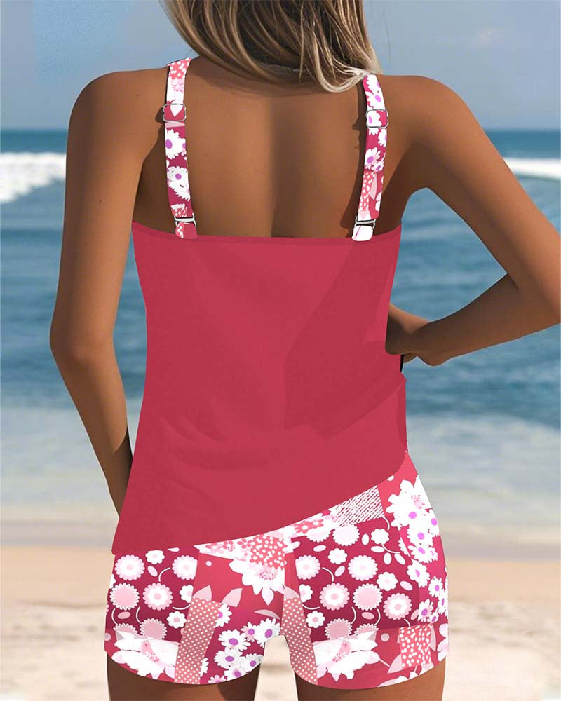 Elegant floral print women's belly-covering tankini and swim shorts set, ideal for relaxed beach days.