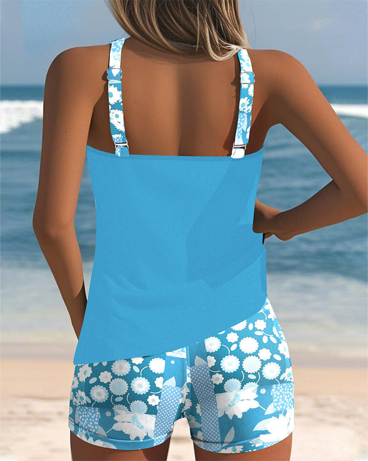 Sporty women's swim set: belly-covering tankini top & comfortable swim shorts, ideal for active beach days.