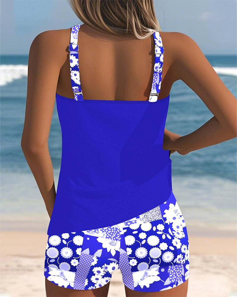 Vacation-ready women's swimwear. Floral belly-covering tankini top & modest swim shorts for the beach.