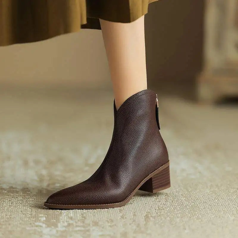 Stylish women's dress ankle boots with a chic pointed toe and comfortable low heel.