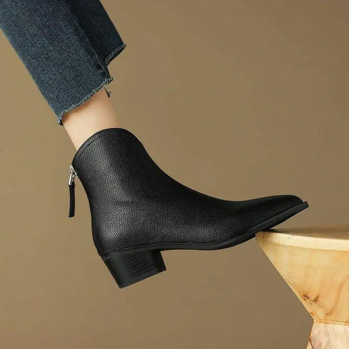 Elegant pointed-toe ankle boots for women, featuring a practical low heel and easy slip-on design.
