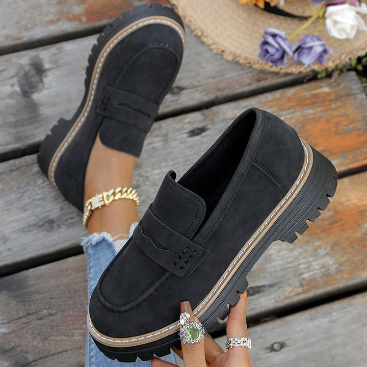 Slip-on women's platform loafers with a chunky sole, combining fashion, comfort, and durability.