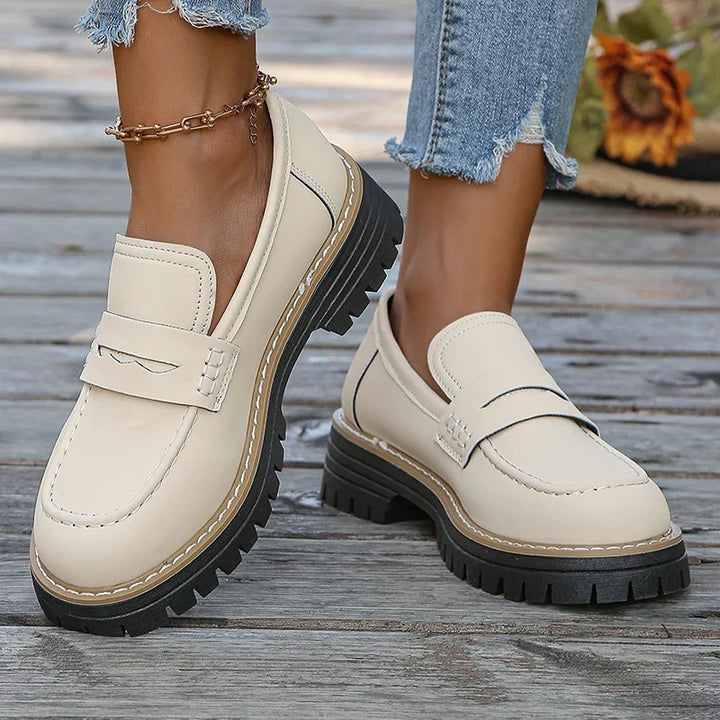 Modern women's slip-on loafers, featuring a robust chunky platform for maximum comfort & style.