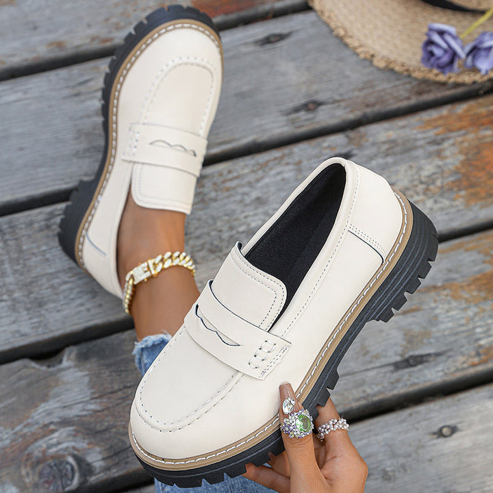 Women's footwear: chunky platform loafers in black, designed for stylish comfort and walking.