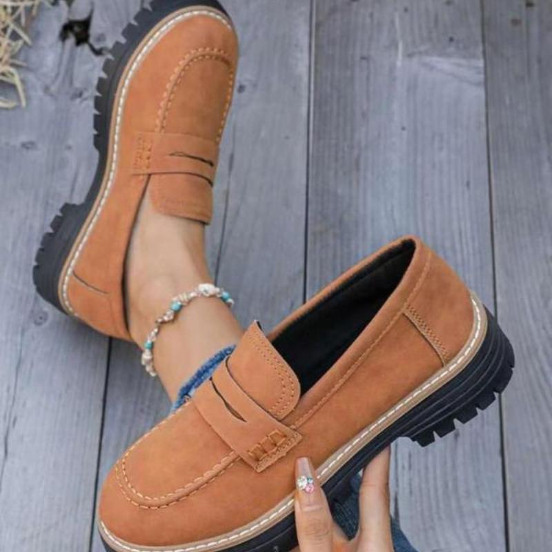 Stylish black women's chunky platform loafers featuring a bold lug sole, ideal for modern trendy outfits.