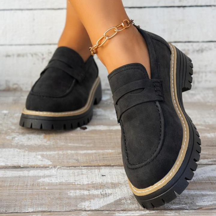 Comfortable women's slip-on platform loafers, a stylish and versatile footwear choice for everyday wear.