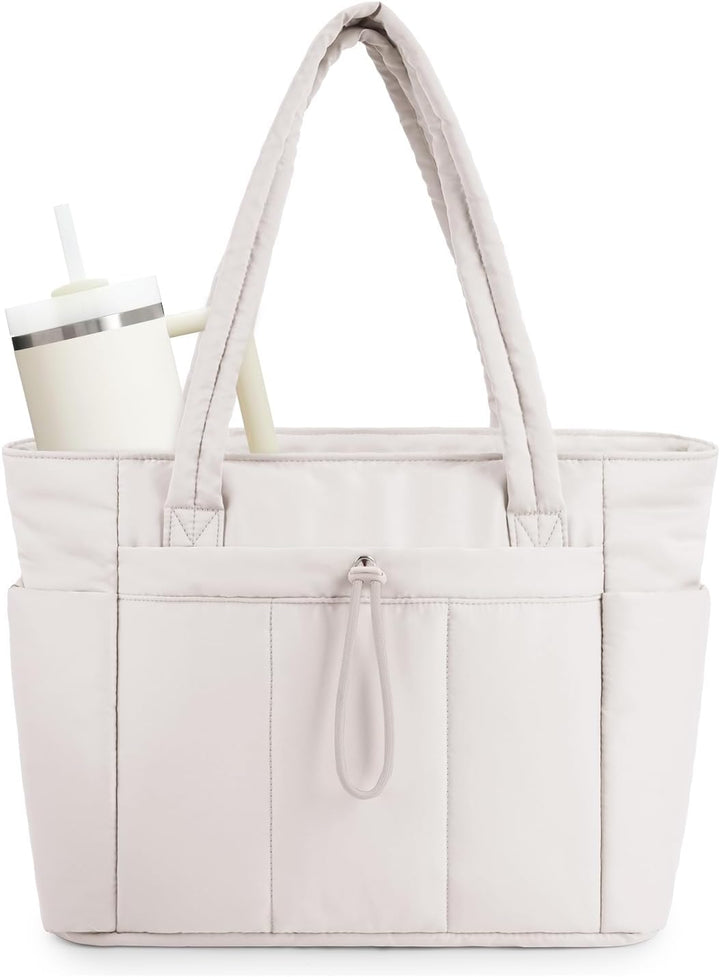 Women's black quilted puffer tote bag with cup holder & laptop sleeve for daily commute.