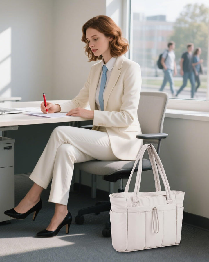 Versatile women's puffer tote for daily essentials, with laptop sleeve & convenient cup holder.
