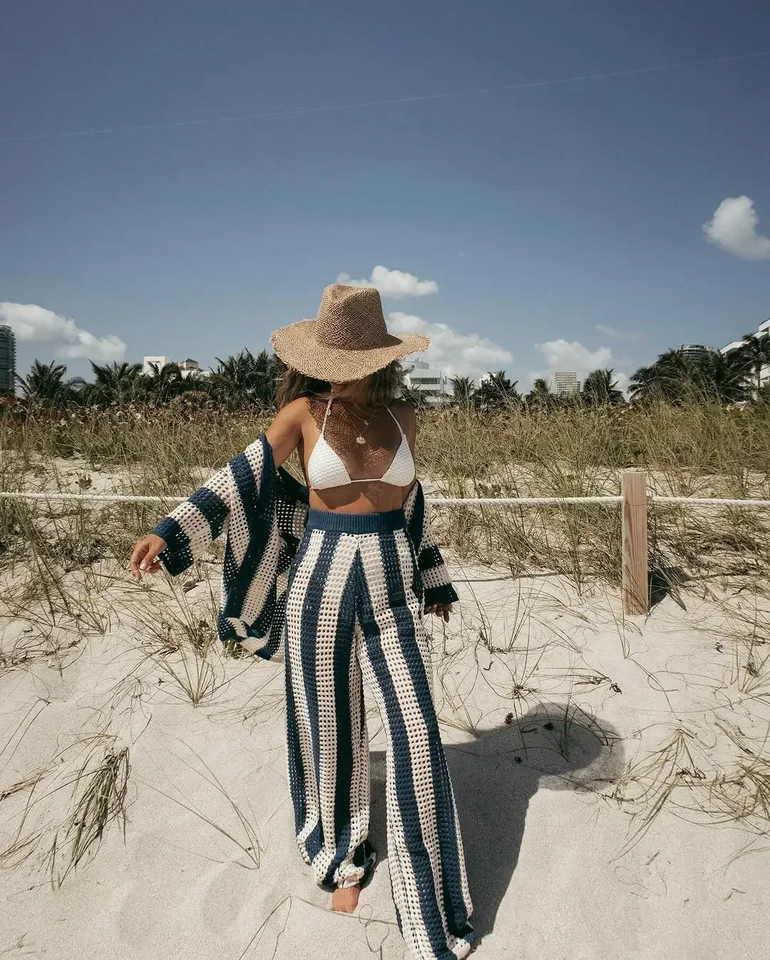 Trendy women's summer bohemian crochet knit two-piece set. Casual beachwear fashion set for women.