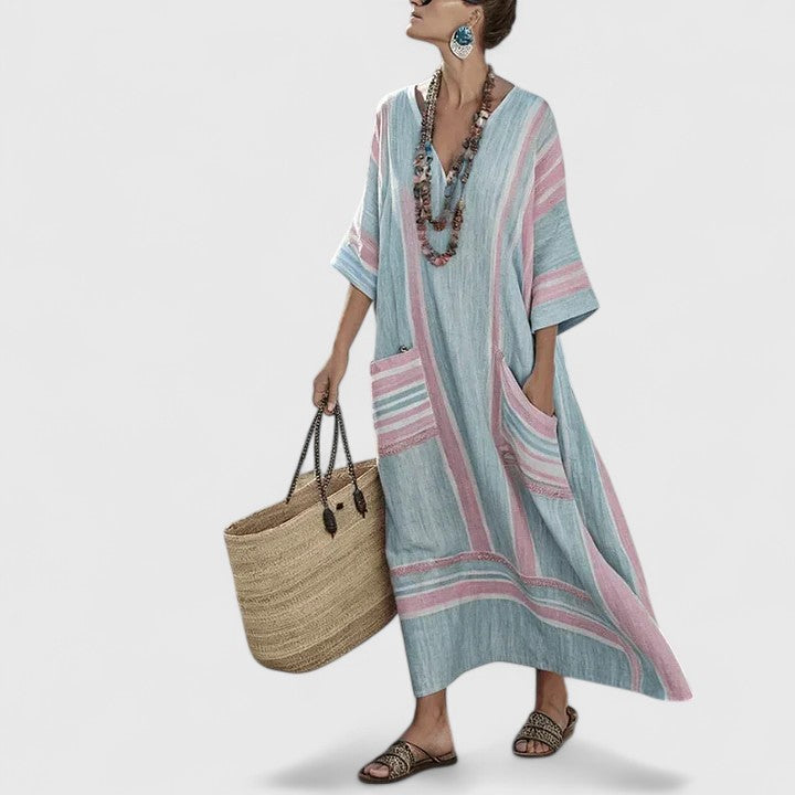 Chic women's flowy bohemian maxi dress, a long summer vacation dress with practical pockets.