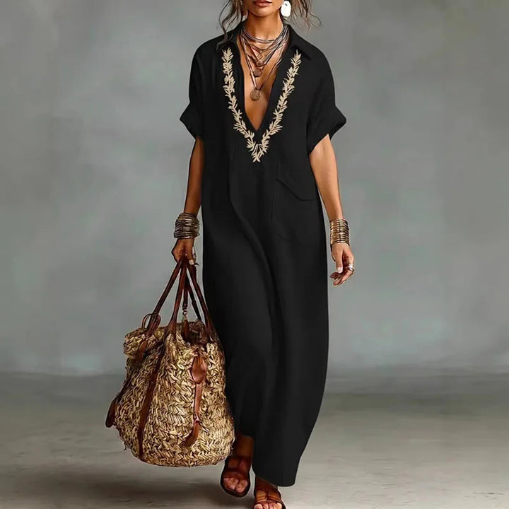 Women's casual elegant bohemian maxi dress with a deep V-neck and beautiful print for summer & beach.