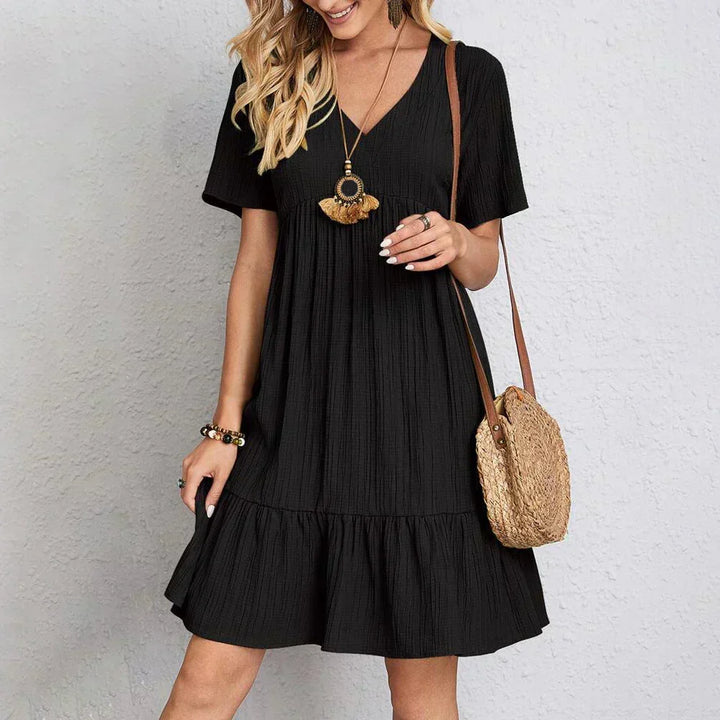 Stylish women's boho chic summer dress with a flattering V-neck and relaxed, comfortable fit for warm days.