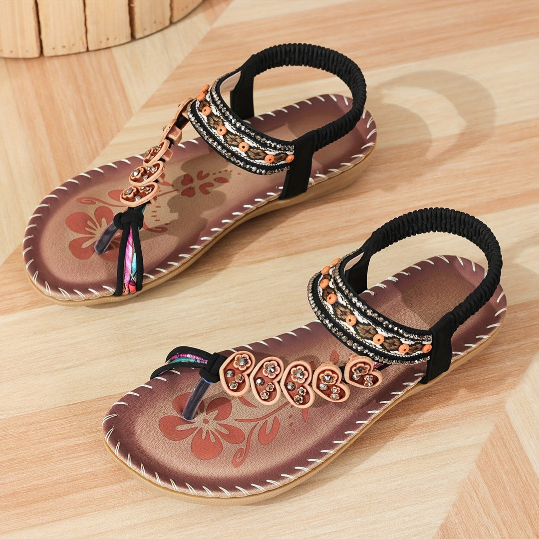 Embellished flat boho sandals for women, detailed with glistening rhinestones and beautiful beadwork.