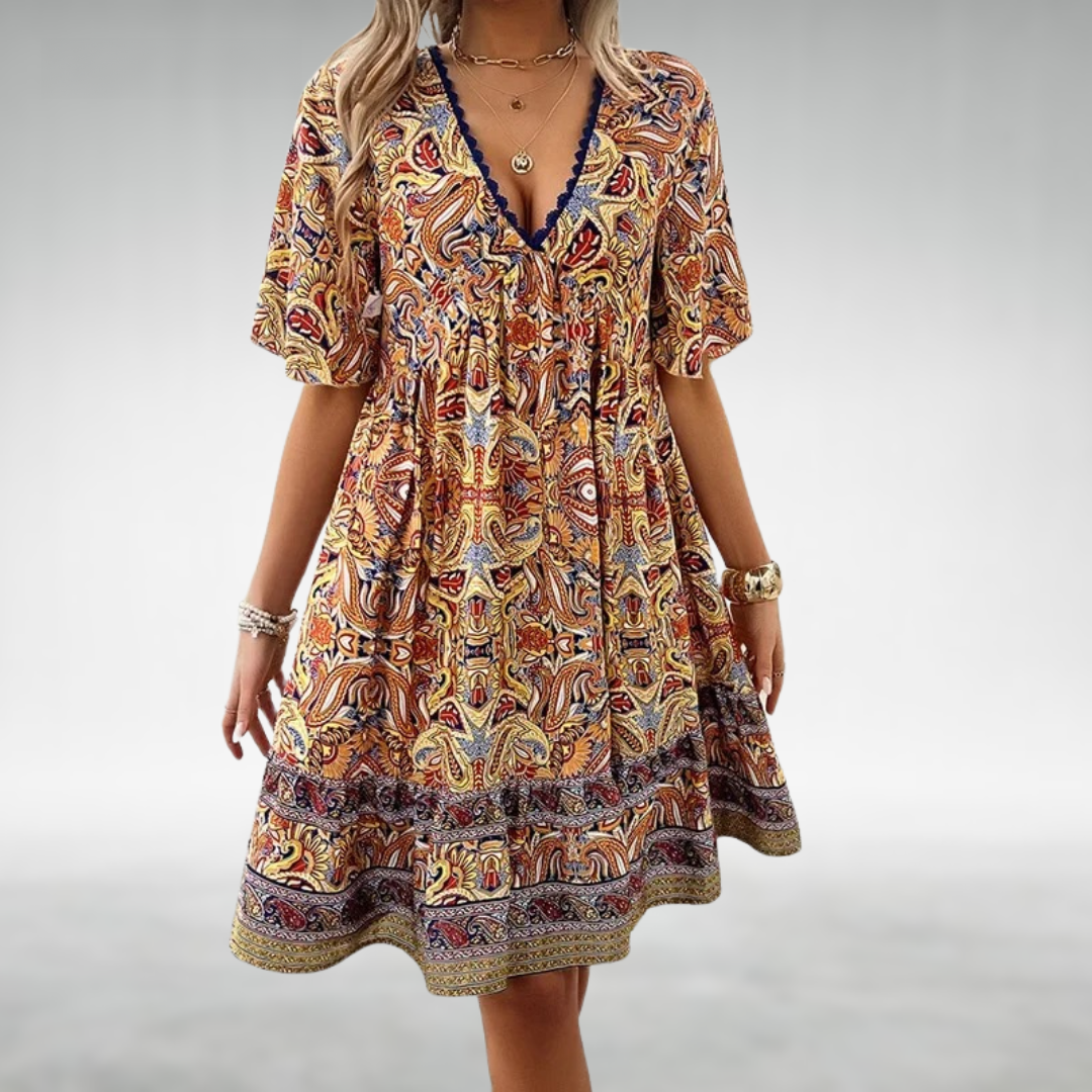 Women's boho mini dress with colorful paisley print, short sleeves. Perfect casual summer or vacation wear.